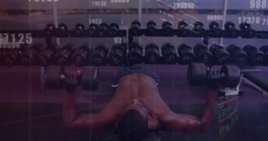 Composite of numbers and data processing over man exercising. Global sports, exercise, data processing and computing concept digitally generated video.