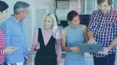 Animation of globe and data processing over caucasian business people at office. Global business, finances and digital interface concept digitally generated video.