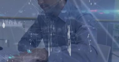 Animation of data processing over caucasian businessman working in office. Global business and digital interface concept digitally generated video.