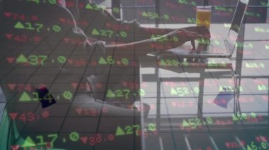 Animation of data processing and arrows over man using laptop. Global business, finance, computing, connections and data processing concept digitally generated video.