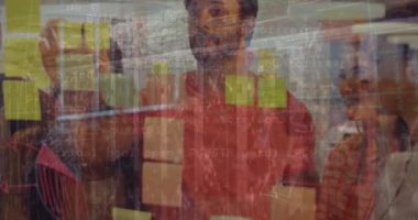 Animation of financial data processing over diverse business people in office. Global networks, computing, business, finance and data processing concept digitally generated video.
