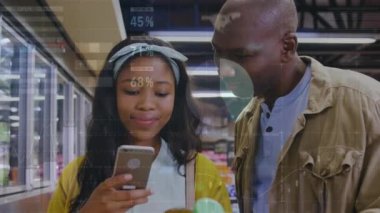 Animation of financial data processing and statistics over woman using smartphone. Global business, finance, data processing and connections concept digitally generated video.