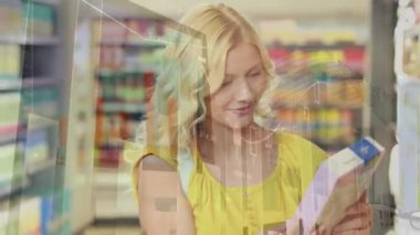 Animation of data processing over caucasian woman shopping. Shopping, retail and digital interface concept digitally generated video.