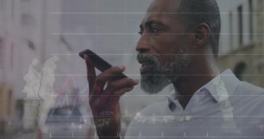 A black man is standing on a city street, using his smartphone. Global technology connections and data processing concept digitally generated video.