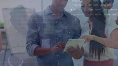 Animation of statistics and financial data processing over businessman using tablet. Global business, finances, computing, networks and data processing concept digitally generated video.