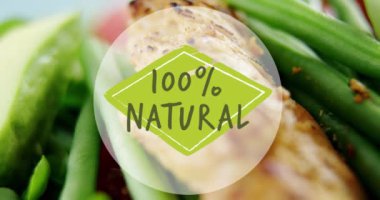 Video of 100 percent natural text over fresh vegetables. Vegan food, fresh fruit and vegetables concept digitally generated video.