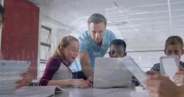 Animation of data processing and globe over caucasian male teacher teaching students at school. School and education technology concept