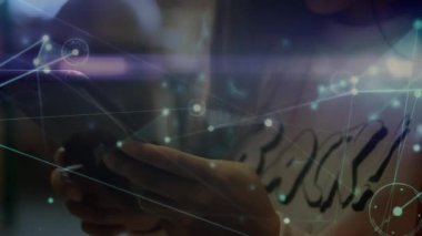 Animation of illuminated connected dots moving over asian girl using digital tablet at home. Digital composite, multiple exposure, childhood, communication, digital native and technology concept.