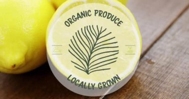 Video of organic produce locally grown text over fresh lemons. Vegan food, fresh fruit and vegetables concept digitally generated video.