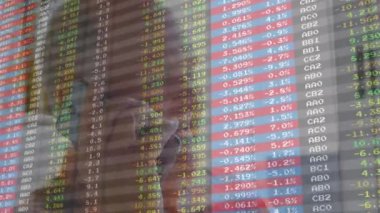 Animation of financial data processing over senior man using smartphone. Global business, finances, computing and data processing concept digitally generated video.