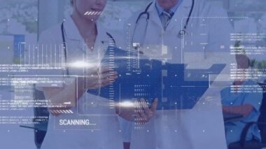 Animation of data processing over caucasian male and female doctors discussing at hospital. Medical healthcare technology concept