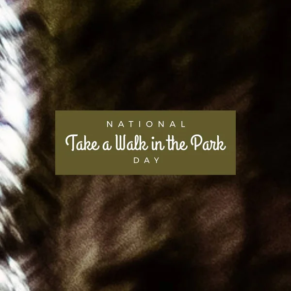 Composition of national take a walk in the park day text over trees. National take a walk in the park day and celebration concept digitally generated image.