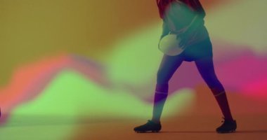 Animation of neon light trails over female rugby player on neon background. Sports and communication concept digitally generated video.