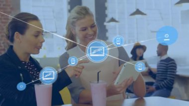 Animation of network of connections with icons over diverse business people. Global business, finances, computing and data processing concept digitally generated video.