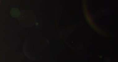 Animation of light spots over black background. Abstract background and pattern concept digitally generated video.