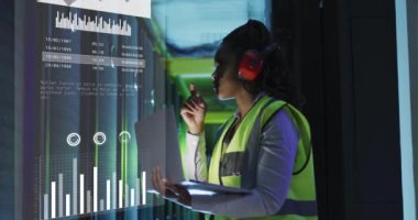 Animation of data processing over african american female it engineer and computer servers. Global computing and data processing concept digitally generated video