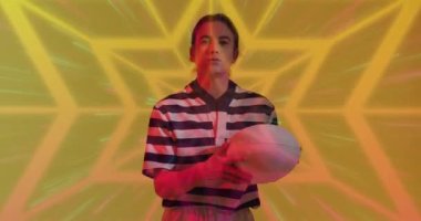 Animation of neon pattern over female rugby player on neon background. Sports and communication concept digitally generated video.