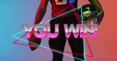 Animation of you win text over american football player and neon triangles. Sports and communication concept digitally generated video.