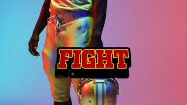 Animation of fight text over american football player on neon background. Sports and communication concept digitally generated video.