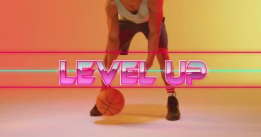 Animation of level up text and neon lines over basketball player on neon background. Sports, competition and communication concept digitally generated video.
