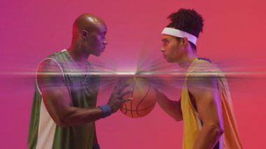 Animation of level up text over basketball players on neon background. Sports and communication concept digitally generated video.
