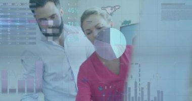 Animation of data processing over diverse business people working in office. Global business, finances, computing and data processing concept digitally generated video.