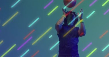 Animation of multiple light trails over basketball player on neon background. Sports and communication concept digitally generated video.