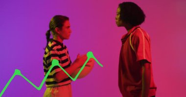 Animation of data processing over female rugby players on neon background. Sports and communication concept digitally generated video.