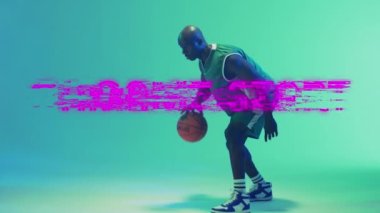 Animation of game start text over basketball player on neon background. Sports and communication concept digitally generated video.
