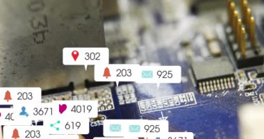 Animation of multiple social media icons against close up of a motherboard. Social media networking and business technology concept