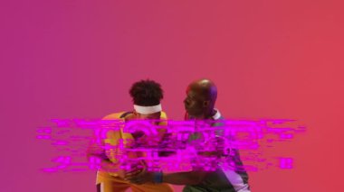 Animation of start text over basketball players on neon background. Sports and communication concept digitally generated video.