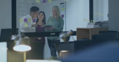 Animation of numbers and data processing over diverse business people working in office. Global business, finances, computing and data processing concept digitally generated video.