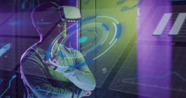 Animation of data processing, african american male it engineer in vr goggles and computer servers. Global computing and data processing concept digitally generated video