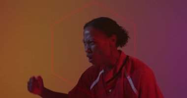 Animation of neon pattern over female rugby player on neon background. Sports and communication concept digitally generated video.