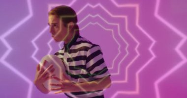 Animation of neon pattern over female rugby player on neon background. Sports and communication concept digitally generated video.