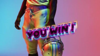 Animation of you win text over american football player and neon background. Sports and competition concept digitally generated video.