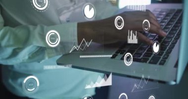 Animation of data processing over african american male it engineer with laptop. Global computing and data processing concept digitally generated video.