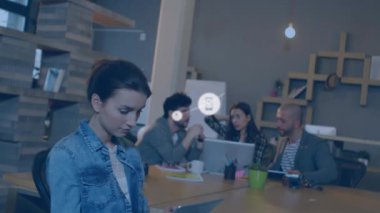 Animation of network of connections with icons over diverse business people. Global business, finances, computing and data processing concept digitally generated video.