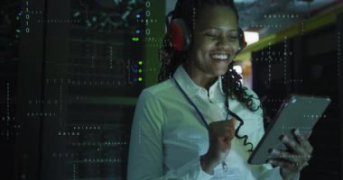 Animation of data processing over african american female it engineer and computer servers. Global computing and data processing concept digitally generated video
