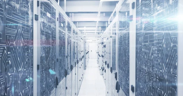 Composition of light trails and computer circuit board over server room. Global business, technology and digital interface concept digitally generated image.