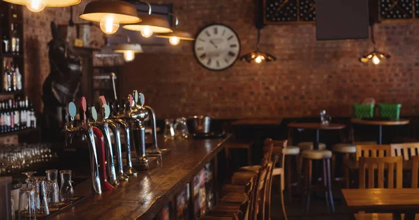 Image of traditional bar with lamps and brick wall. National beer day concept digitally generated video.