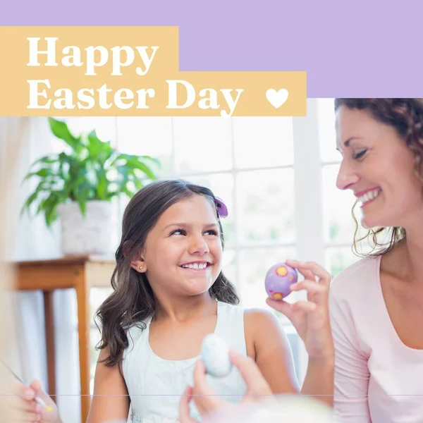 Composition of happy easter sunday text and caucasian mother with daughter painting easter eggs. Easter, religion and tradition concept digitally generated image.