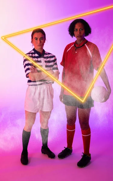 Illuminated Triangle Multiracial Female Rugby Players Ball Standing Purple Background — Zdjęcie stockowe