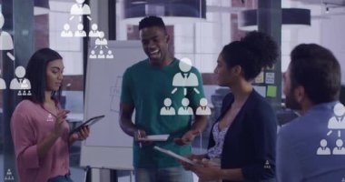 Animation of networking icons and data processing over diverse business people. Global networks, business, finances, computing and data processing concept digitally generated video.