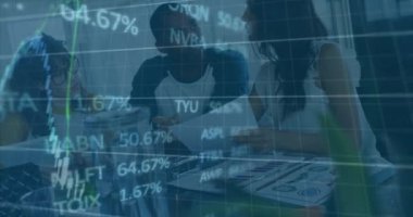 Animation of financial data processing over diverse colleagues discussing over documents at office. Global finance and business technology concept