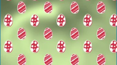 Animation of easter eggs on green background. Easter, tradition and celebration concept digitally generated video.