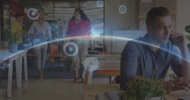 Animation of globe and scope scanning over diverse business people working at office. Global business, technology and digital interface concept digitally generated video.