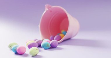 Bucket with colorful easter eggs on purple background with copy space. Easter, tradition and celebration concept.