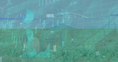 Animation of statistical data processing against spinning windmills on grasslands. Renewable energy and business data technology concept