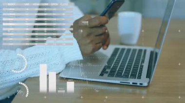 Animation of statistical data processing against mid section of man using smartphone. Business data technology concept